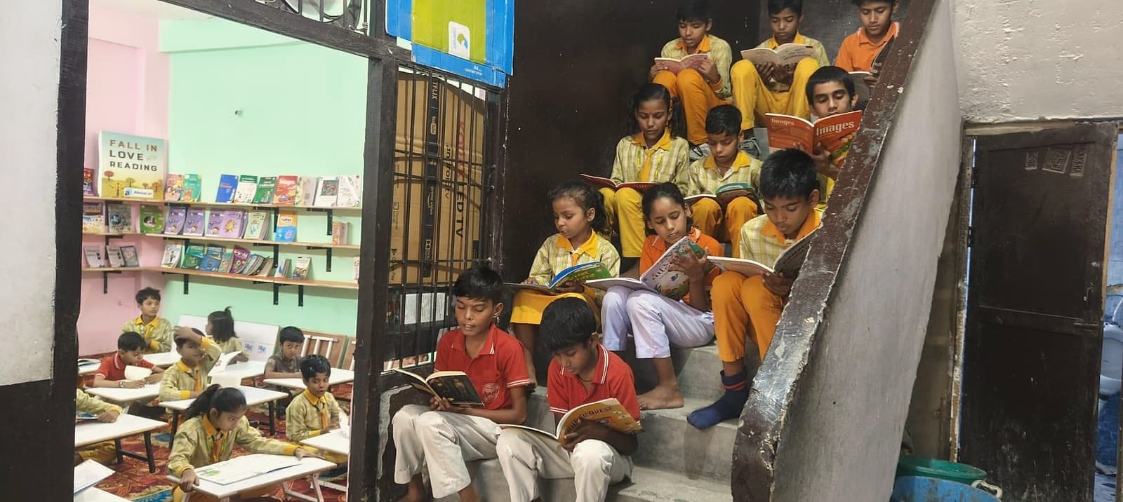Students reading together on the floor of the centre library